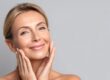 Woman with healthy radiant skin demonstrating skin longevity skincare results
